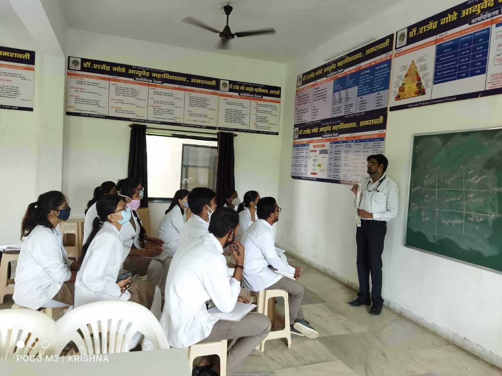 Faculty member teaching Ayurvedic concepts in a classroom