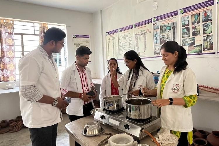 Faculty and students preparing an Ayurvedic formulation